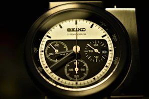 Chronograph watch face showing detailed subdials with sharp black and white contrast.