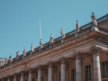 beige concrete building under blue sky during daytime