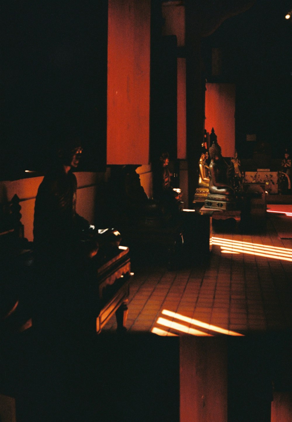 people sitting on bench during night time