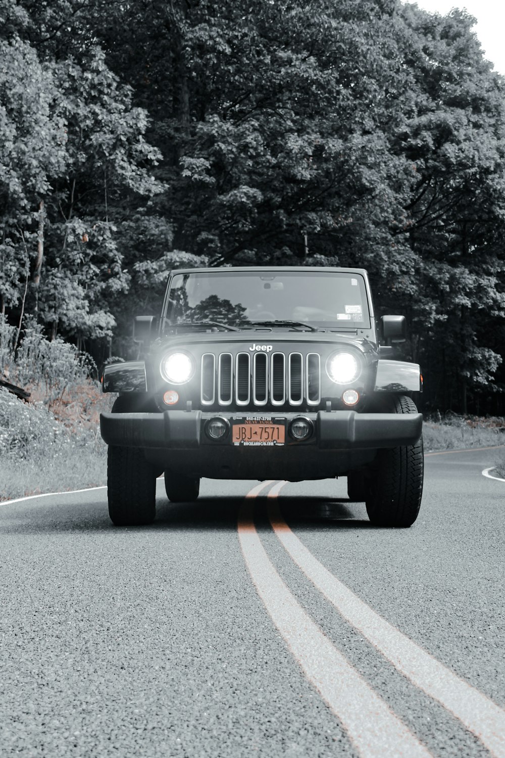 black jeep wrangler on road