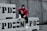 A person wearing a red jacket, black pants, and white sneakers is sitting on concrete barriers with 'NYPD' stenciled on them. The individual is also wearing a face mask and hoodie, giving a sense of anonymity. The background features a gray concrete wall.