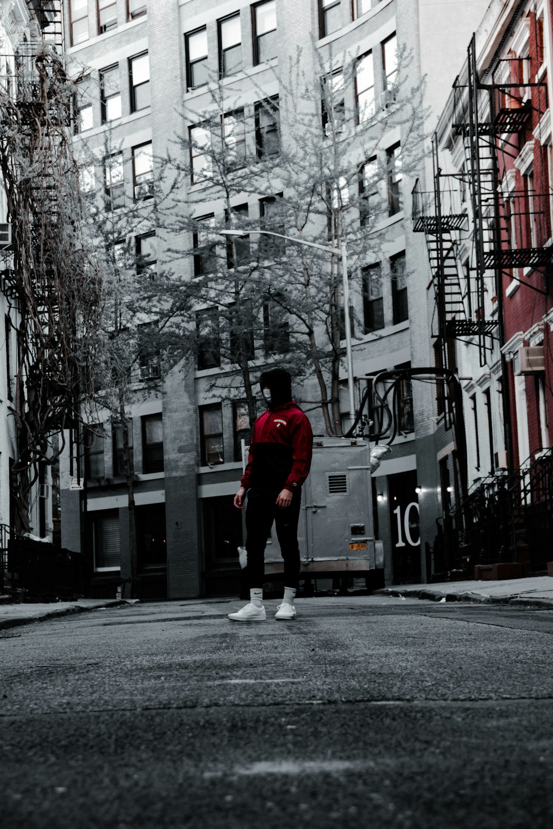man in red hoodie walking on street during daytime photo – Free Grey ...