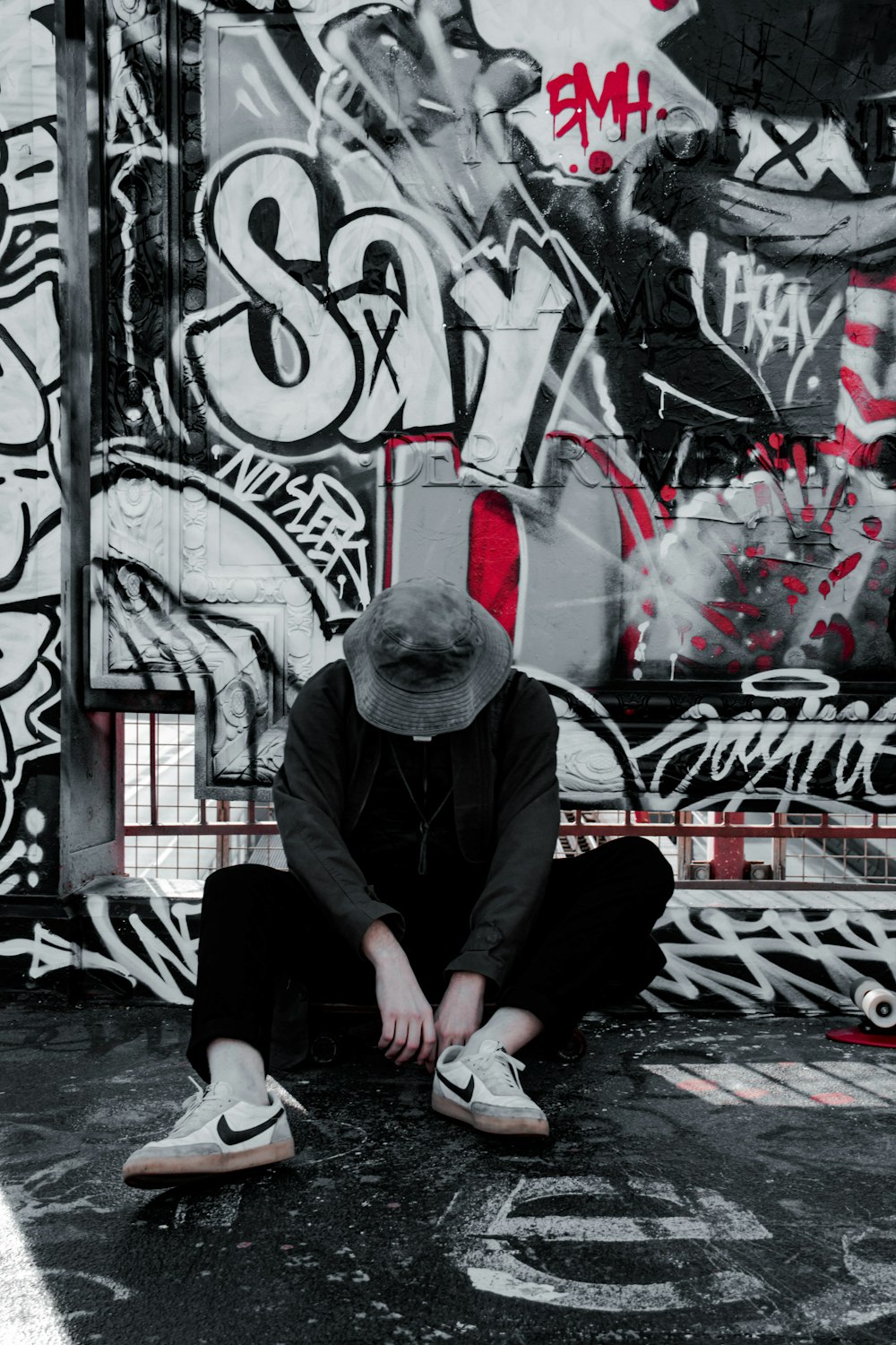 man in black long sleeve shirt sitting on floor