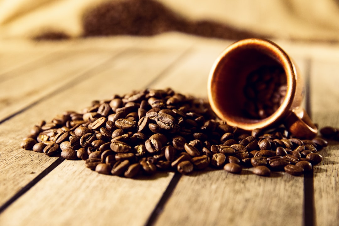 brown coffee beans on brown wooden table