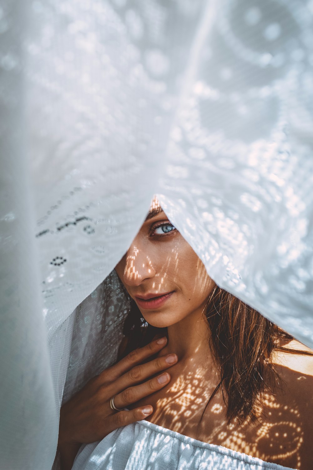woman in white floral veil