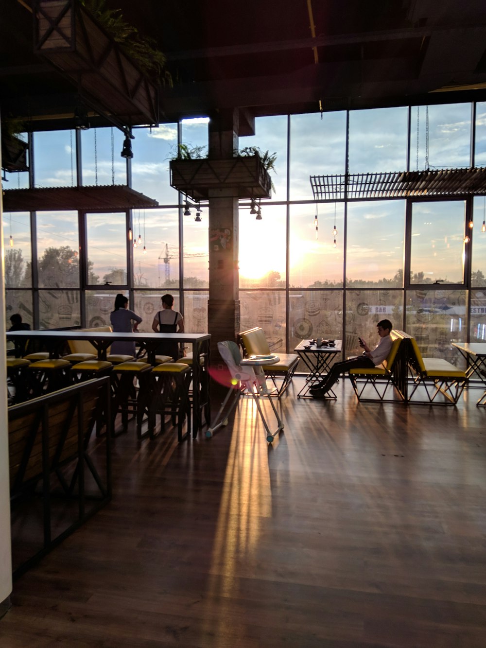 people sitting on chair near table during daytime