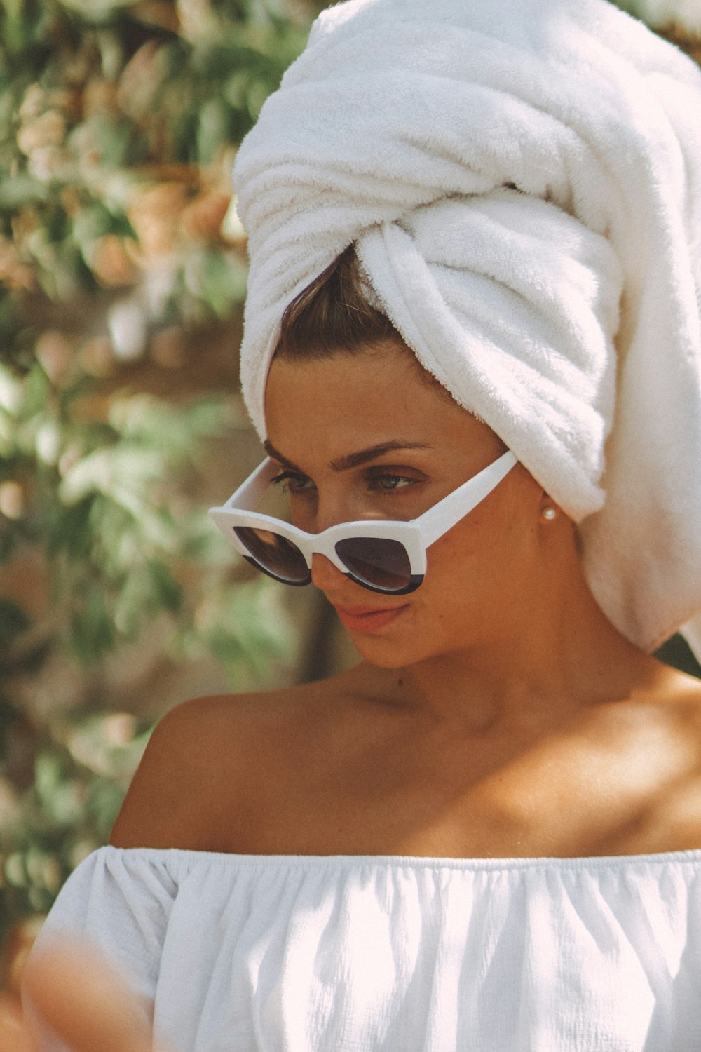 woman wearing white framed sunglasses