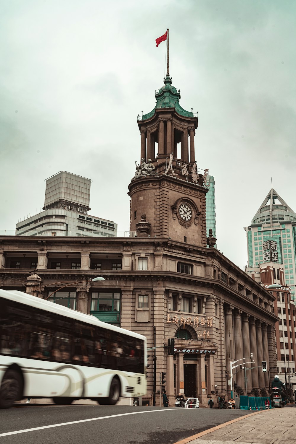 brown concrete building under white clouds during daytime