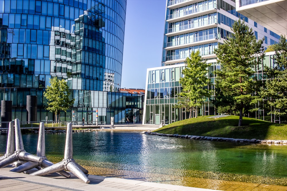 white and blue concrete building near body of water during daytime