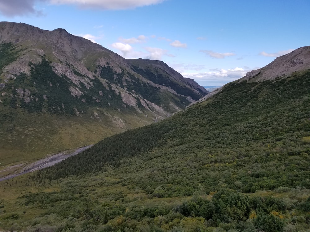 green and brown mountains under blue sky during daytime