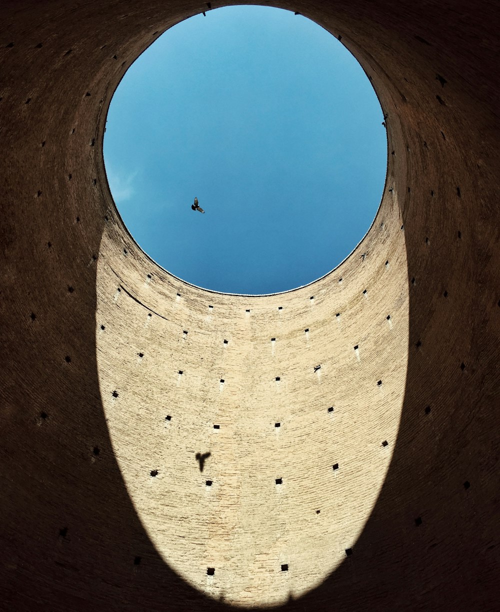 brown concrete wall under blue sky during daytime