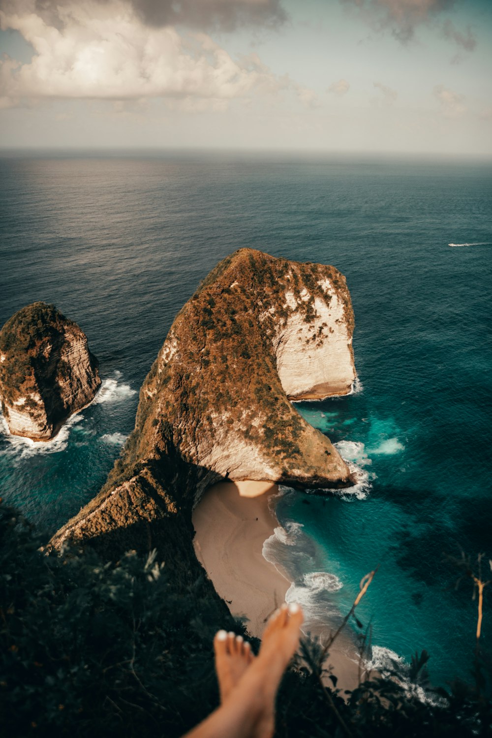 brown rock formation on sea during daytime