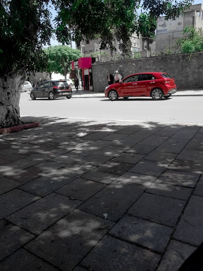 Gary patiently guiding a new driver through parallel parking on a quiet street.