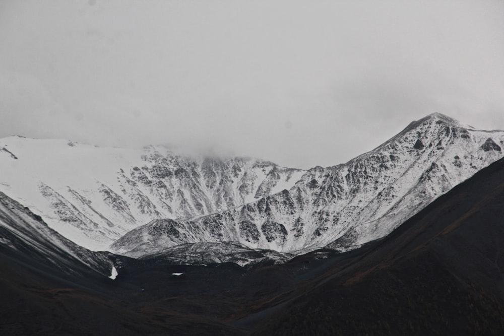 snow covered mountain during daytime