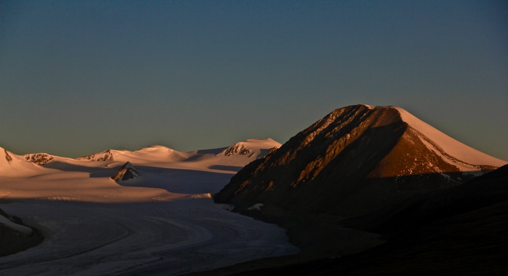 brown mountains under blue sky during daytime