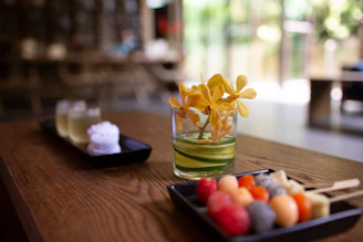 a wooden table topped with a plate of food