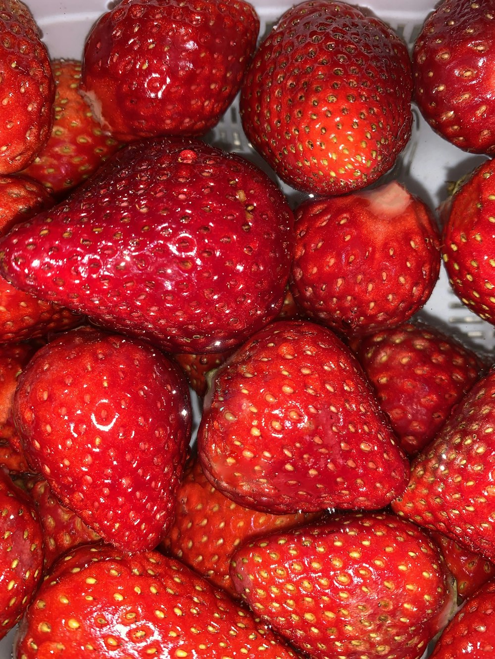 red strawberries in white container