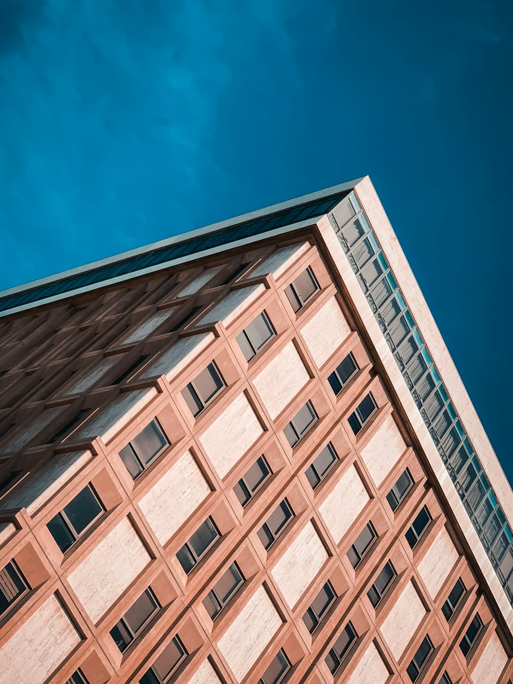 brown concrete building under blue sky during daytime