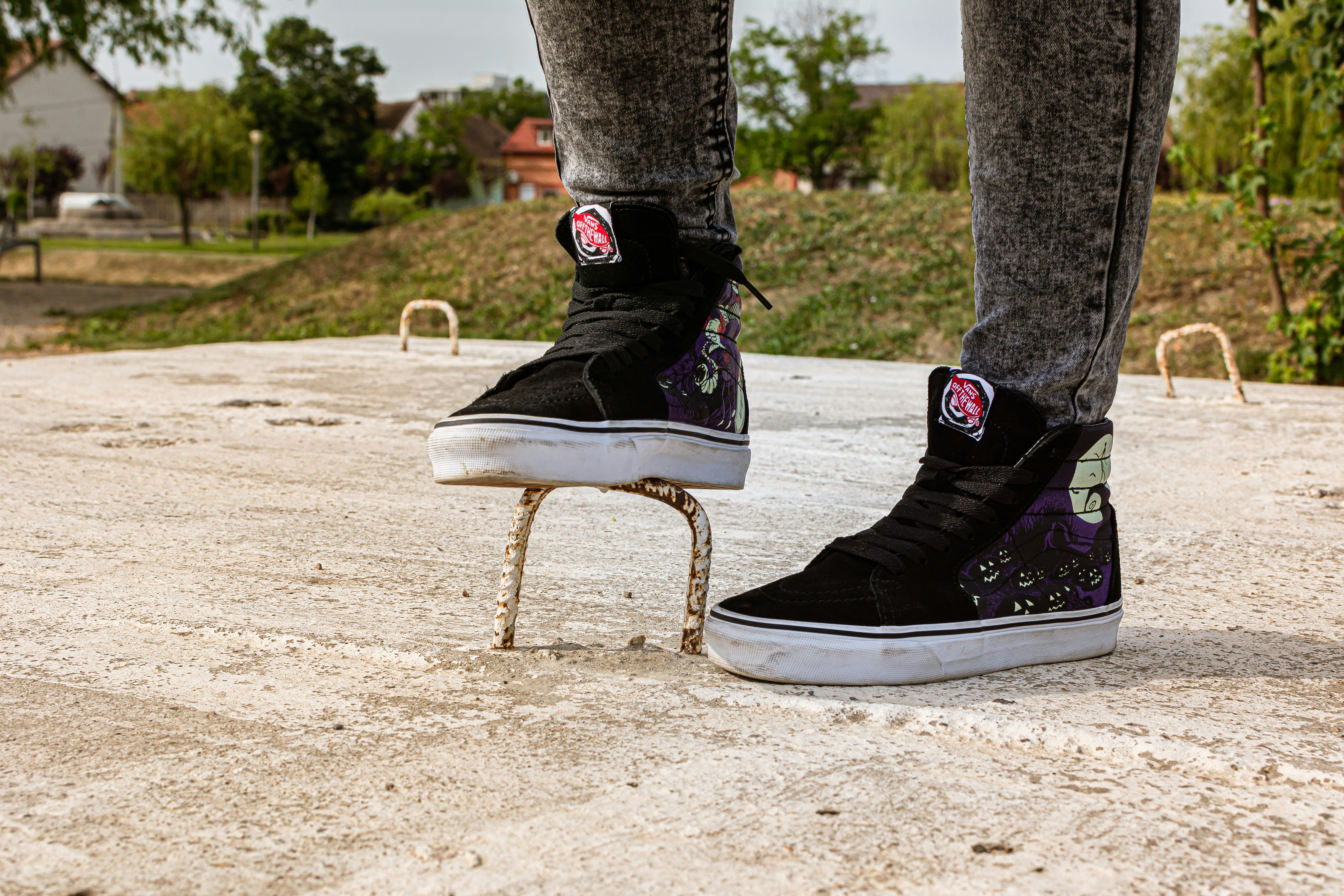 person wearing black and white nike high top sneakers