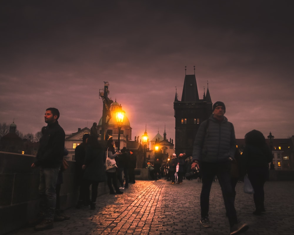 people walking on street during night time