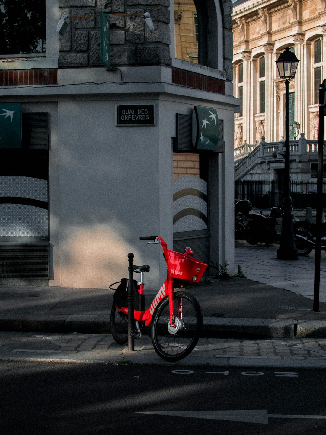 red bicycle parked on sidewalk during daytime