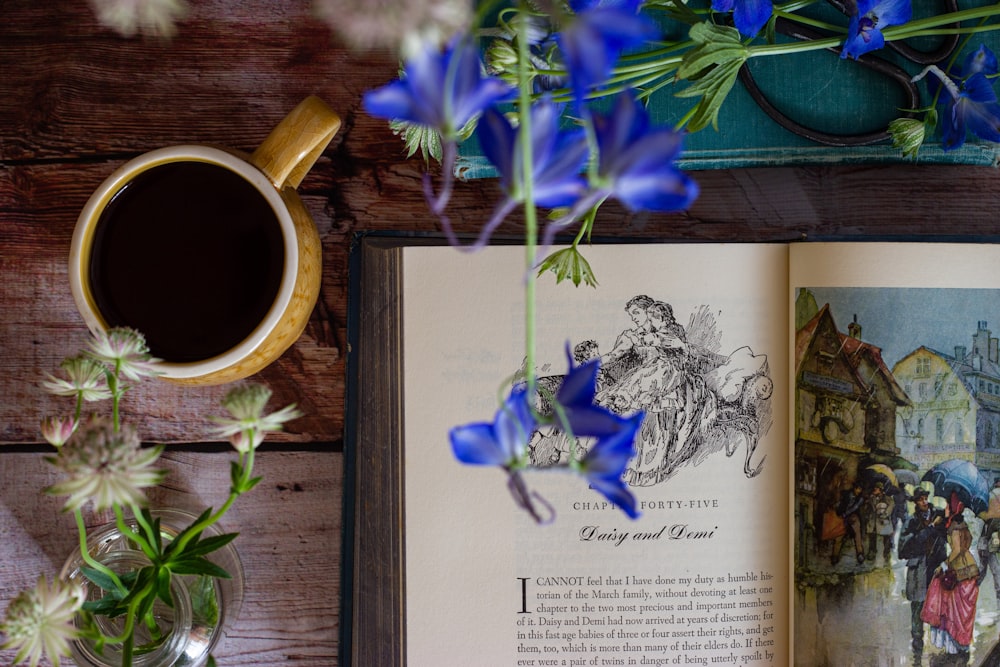 blue and white flower on brown wooden table