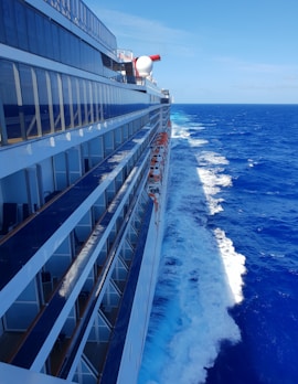 white and blue ship on sea during daytime