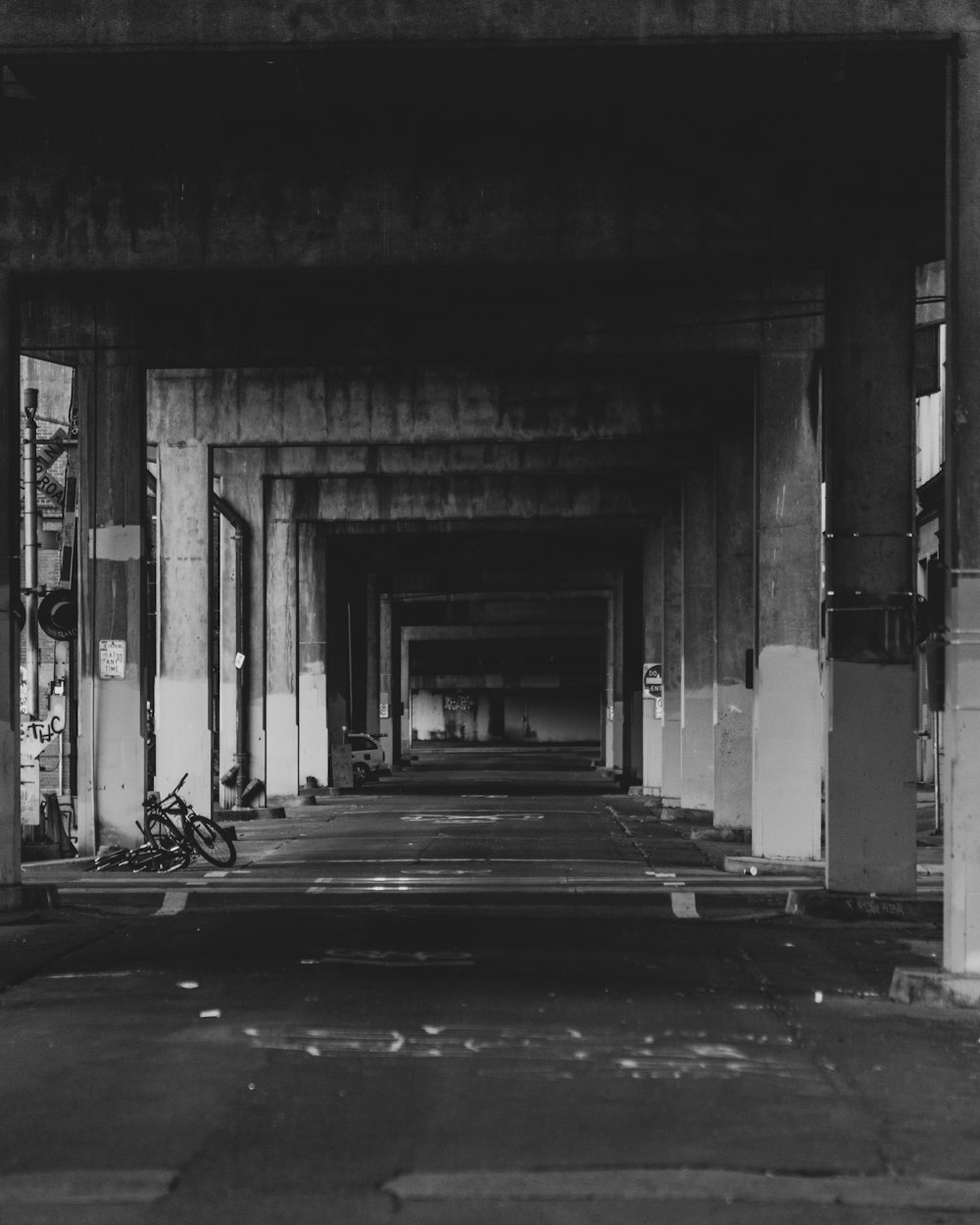 grayscale photo of a hallway