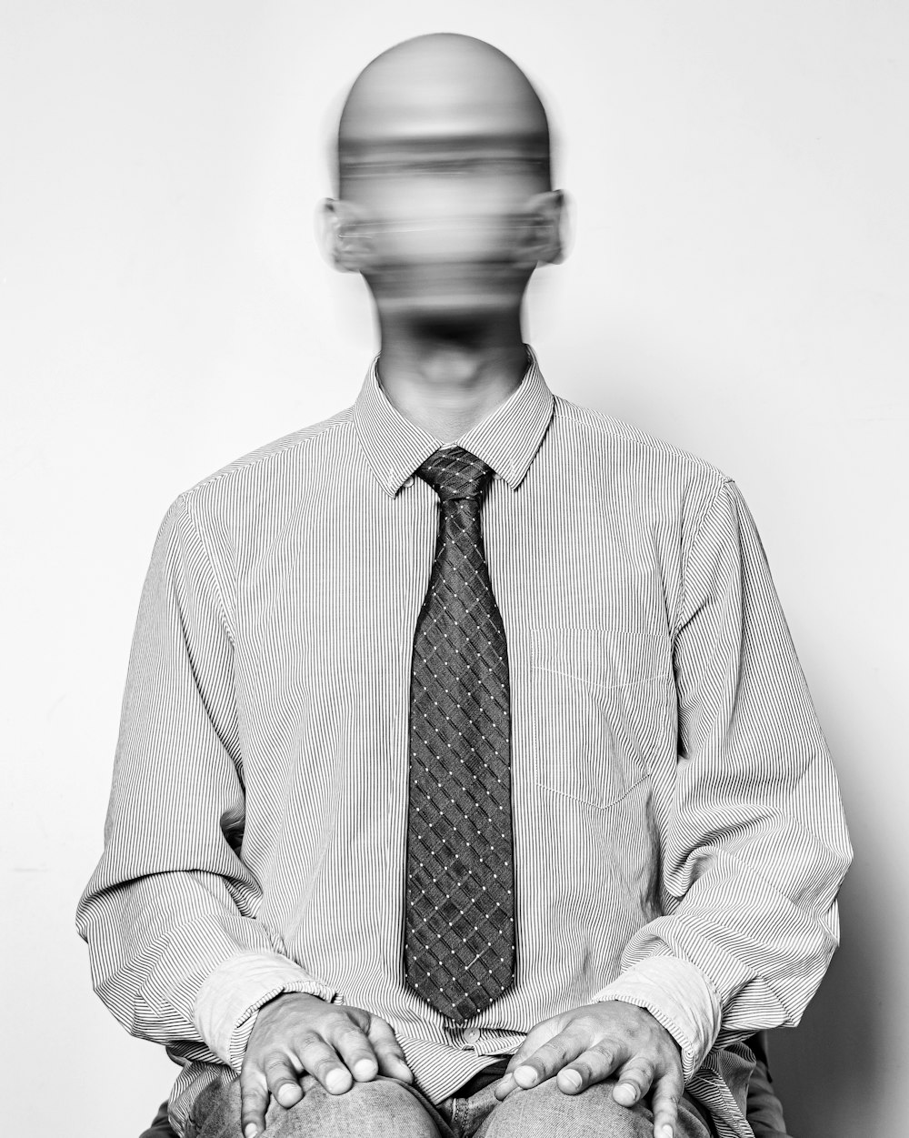 man in white dress shirt and black and white necktie