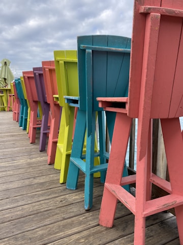 Rows of finished chairs lined up, showcasing a variety of styles and colors.