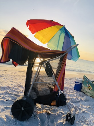 Close-up of a sleek, insulated Caribbean cooler bag on a sunny beach.