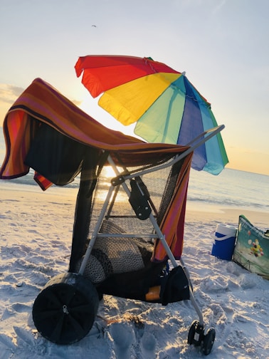 Close-up of a sleek, insulated Caribbean cooler bag on a sunny beach.