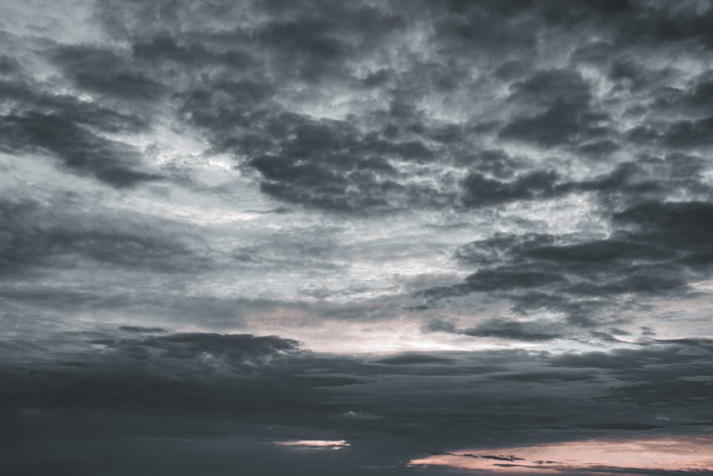 black clouds over the sea during sunset