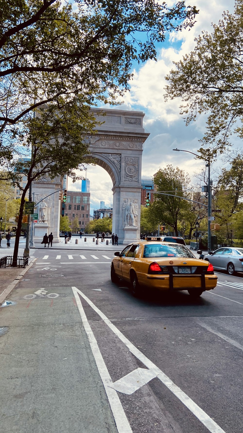 yellow sedan on road during daytime