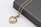 A beautifully crafted personalized necklace displayed with a gift box.