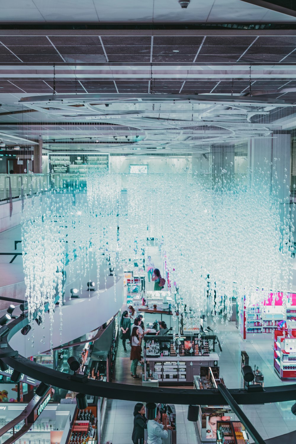 people in a building with blue lights