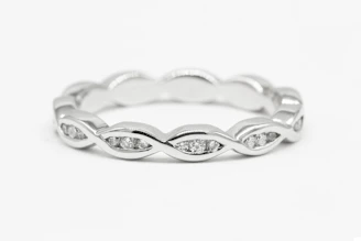 a white gold ring with diamonds on it