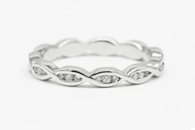 a white gold ring with diamonds on it