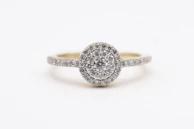 A luxurious engagement ring with a unique setting and brilliant cut diamond.