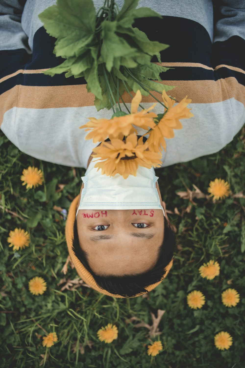 man in gray and brown long sleeve shirt with yellow and green maple leaves on his