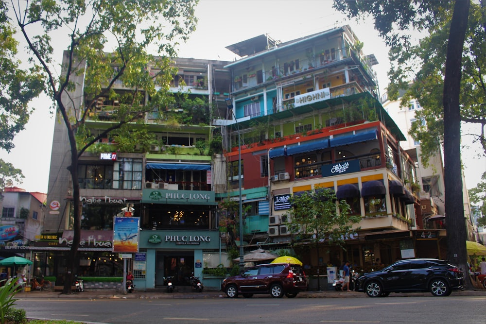 cars parked in front of building during daytime