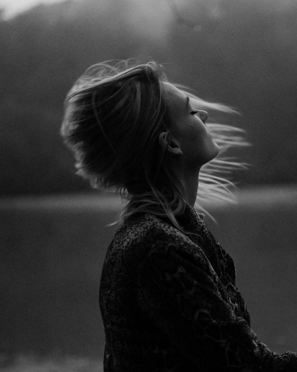 grayscale photo of woman in black floral shirt