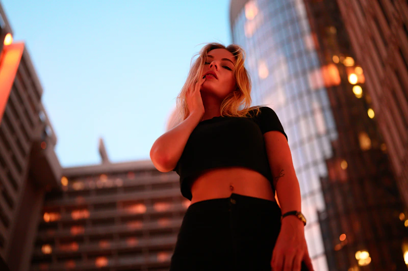 Stylish BBW woman in black crop top in the city