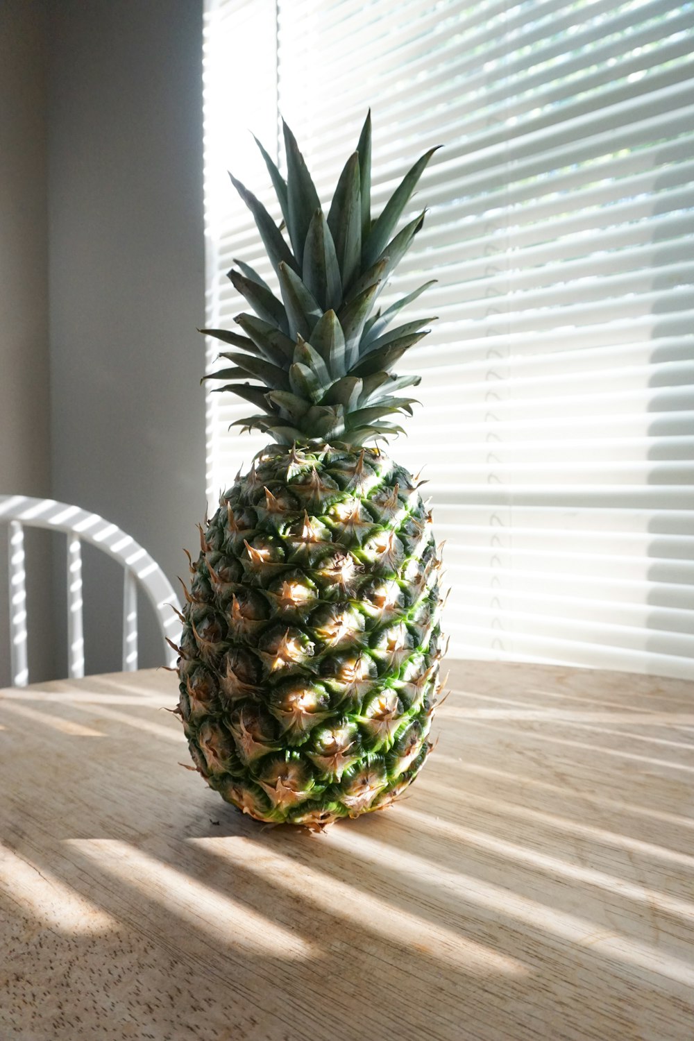 pineapple fruit on brown wooden table