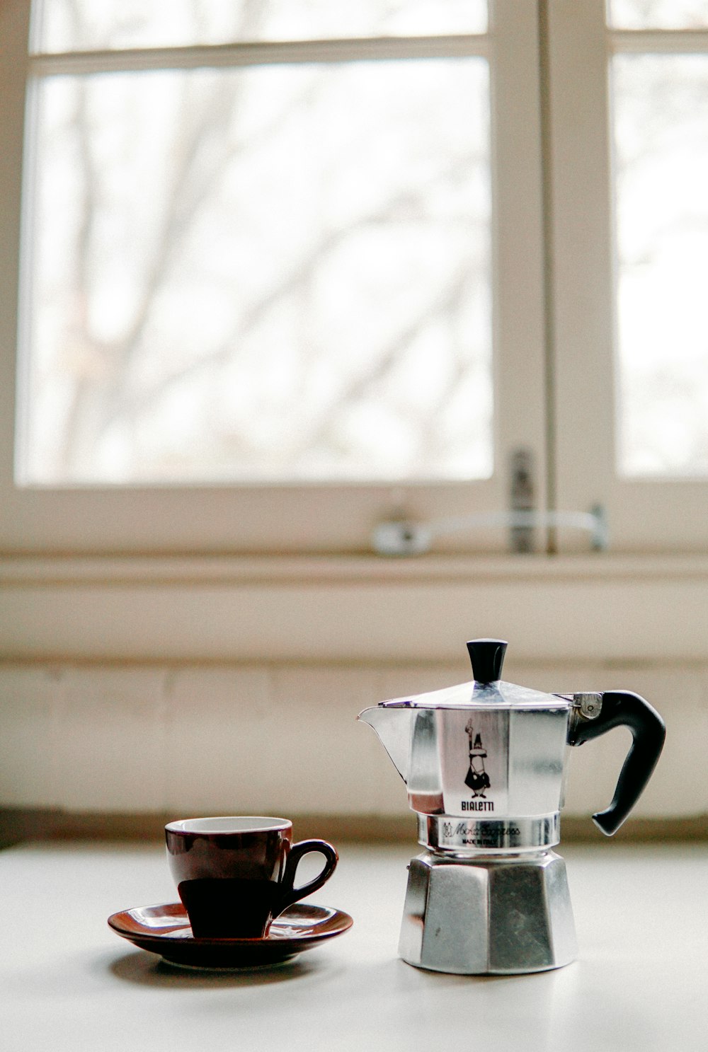 silver and black coffee pot