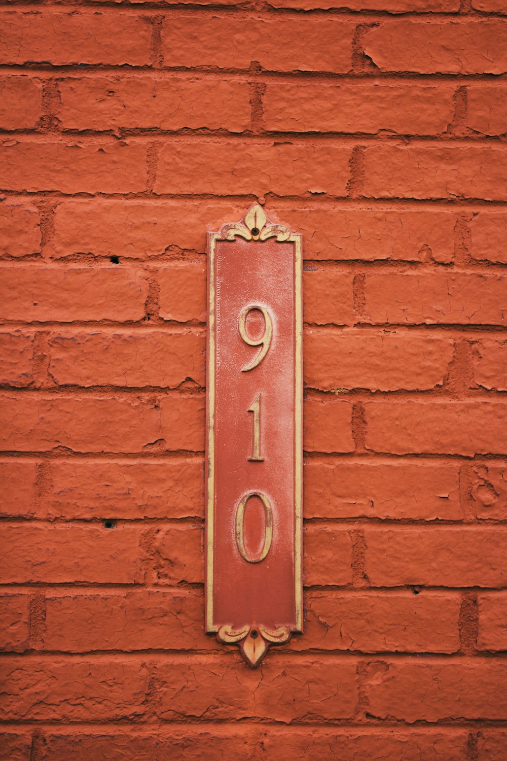 red metal door on red brick wall