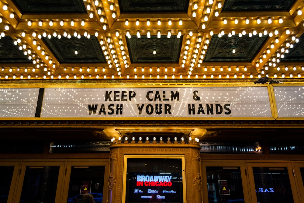 a sign that says keep calm and wash your hands