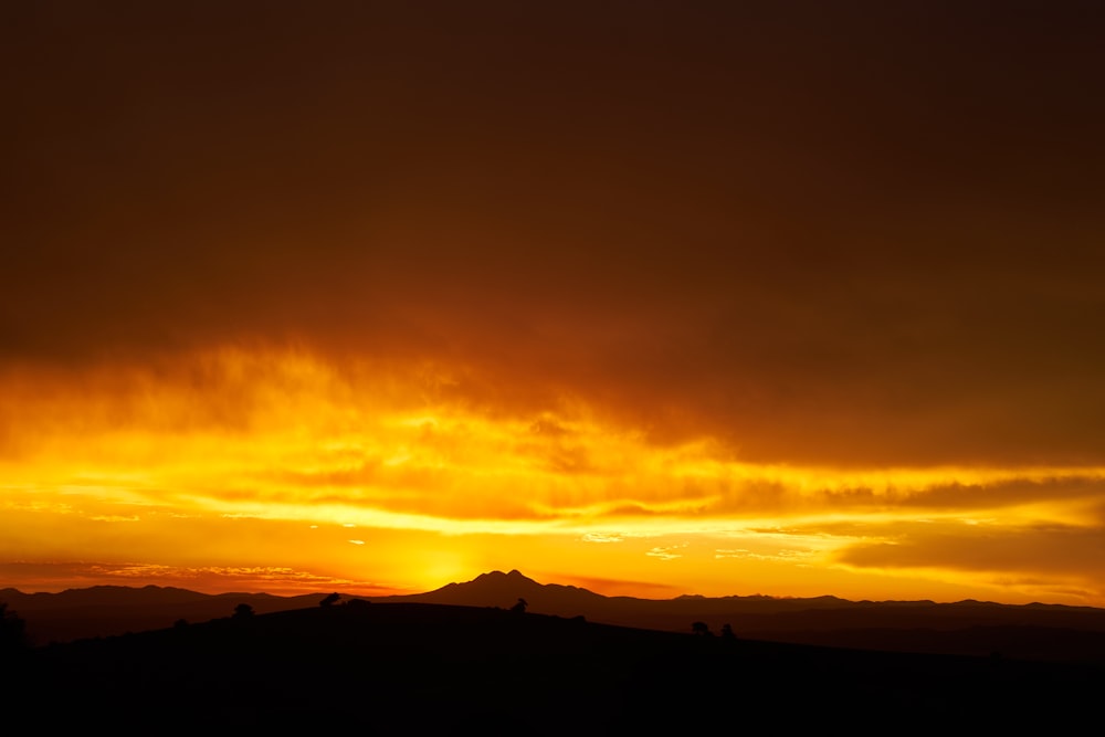 silhouette of mountain during sunset