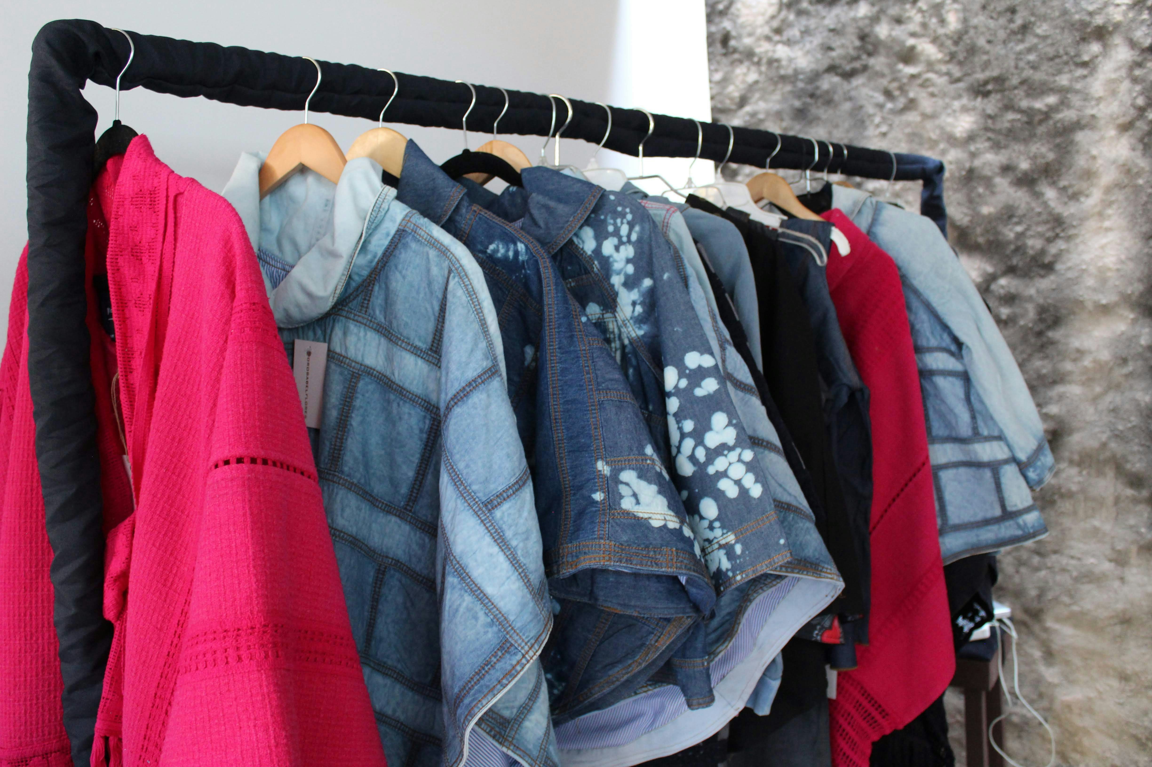 Pink dress and fashion clothing on rack