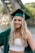 woman in green academic gown